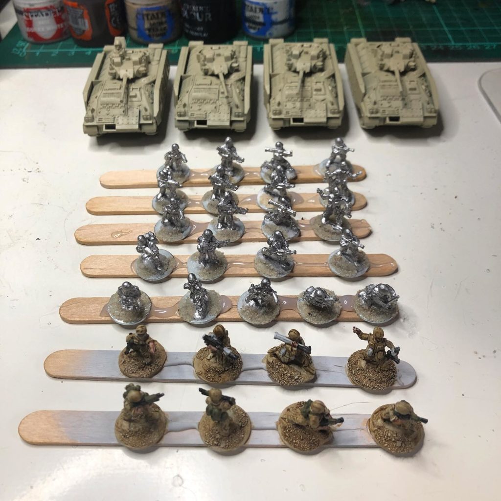 Production line of a 15mm modern British army mechanised infantry platoon.